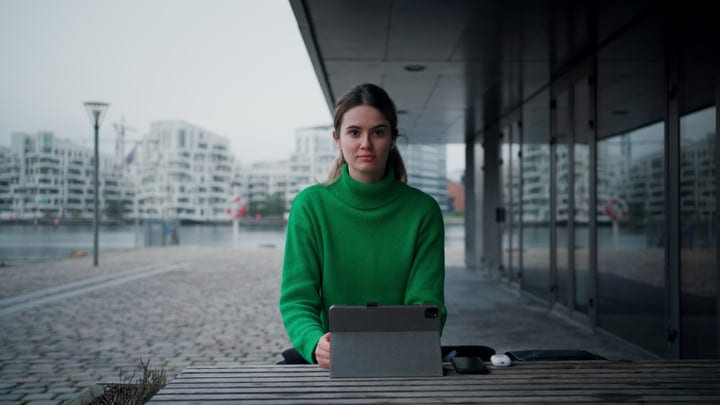 Focused Businesswoman Working Outdoors In Copenhagen Serenity