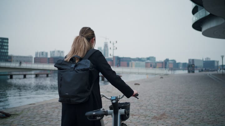 Urban Explorer Embraces Copenhagen's Serene Waterfront Ride