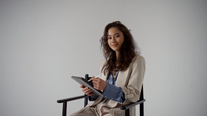 Confident Woman Sketching Ideas On Digital Tablet