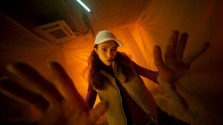 Confident Gaze Under Warm Studio Lights Captivates