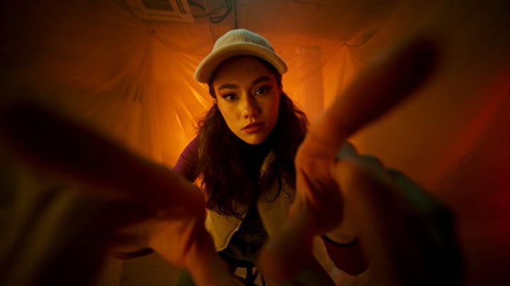 Captivating Gaze Through The Lens In Warm Studio Glow