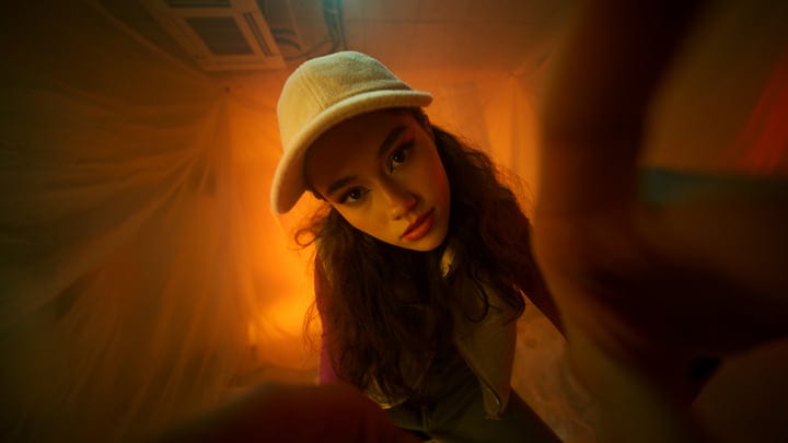 A Youthful Gaze Captured In Warm Studio Lights