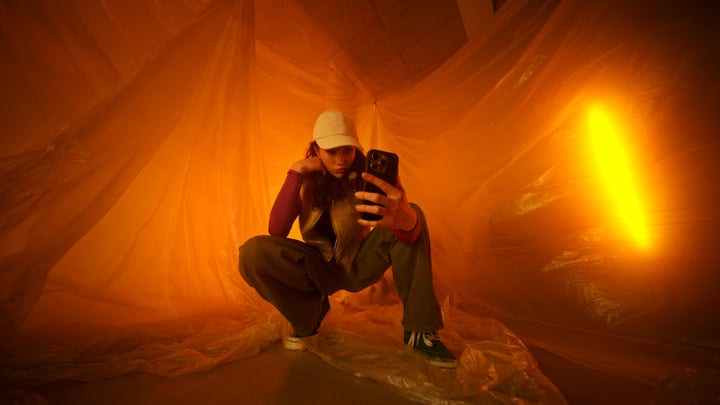 Youthful Expression in a Vibrant Orange Setting