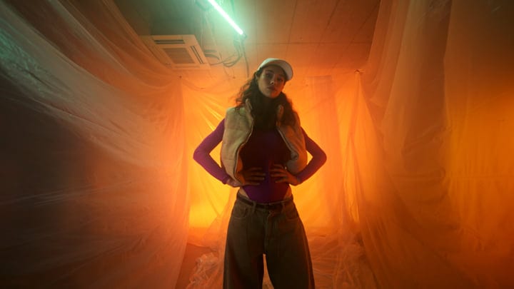 Bold Fashion Statement Under Neon Glow in Studio