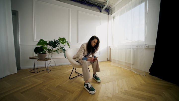 Quiet Reflection In A Sunlit Modern Studio Space