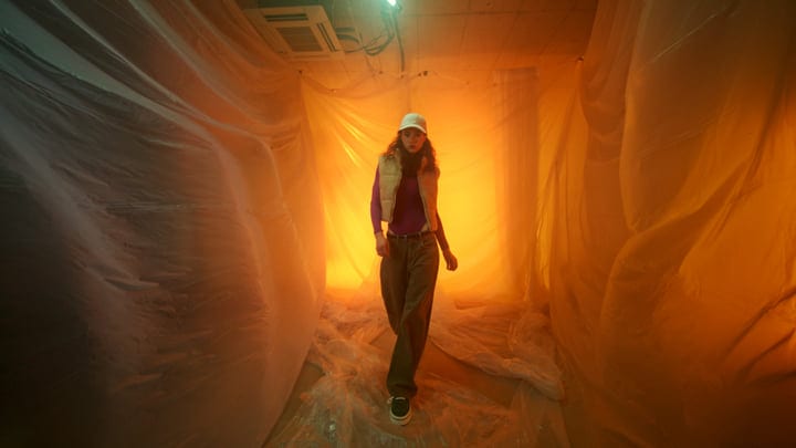 Bold Fashion Walk Through a Neon-Lit Studio