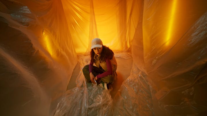 A Young Model Embraces Bold Fashion in Studio Glow