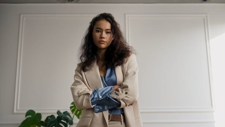 Confident Expression In Stylish Beige Blazer In Studio Light