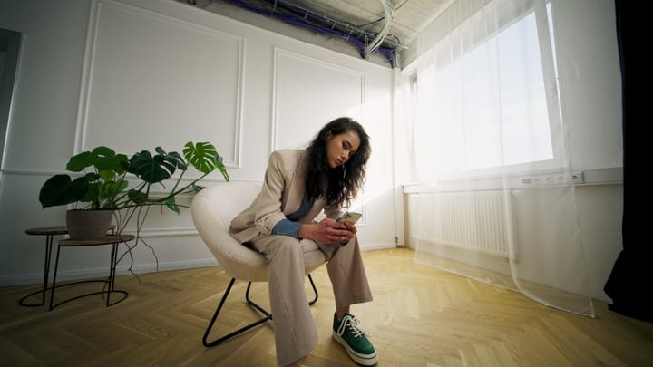 Contemplative Moment In Modern Minimalist Office Setting