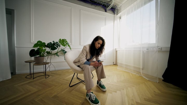 Contemplative Moment In A Sunlit Studio Space