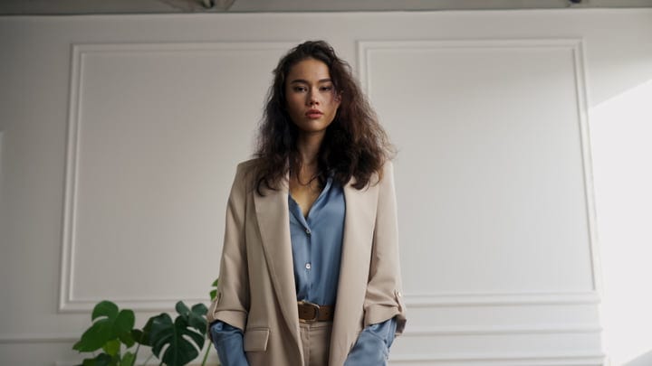 Confident Model Embraces Chic Neutrals In Studio Setting
