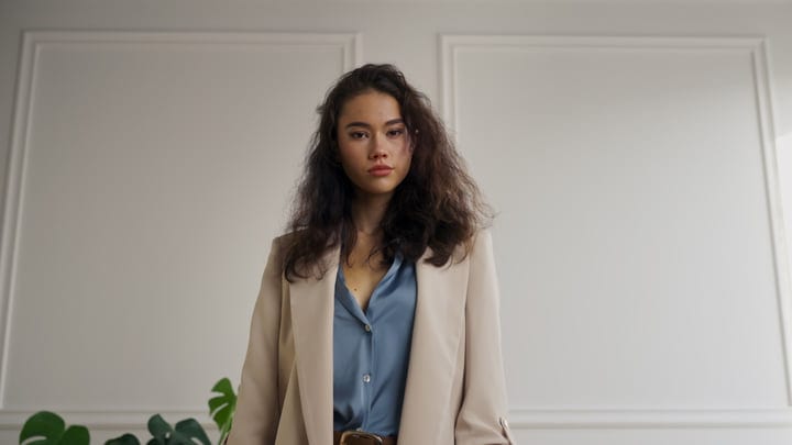 Confident Expression in Chic Blazer and Silk Blouse