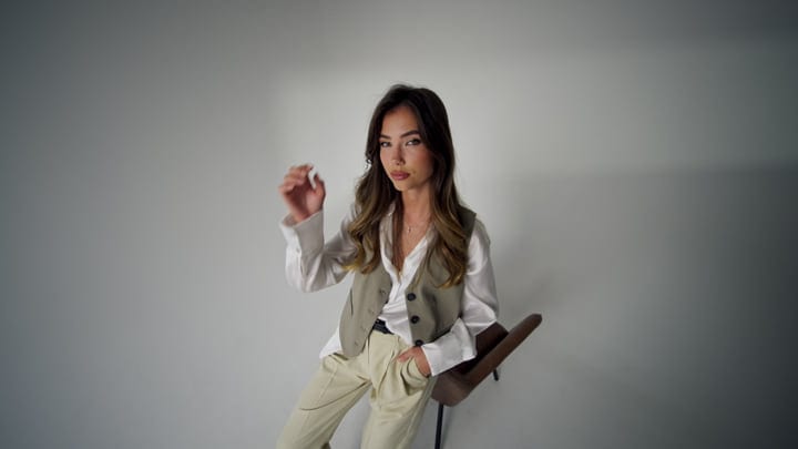 Contemplative Moment In Chic Studio Fashion Portrait