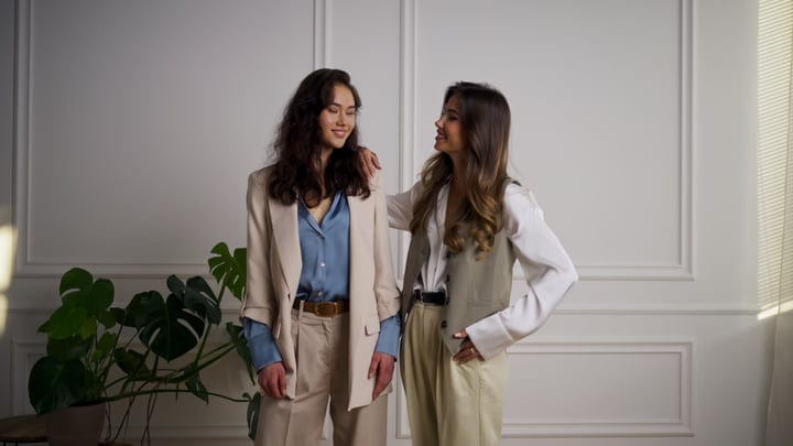 Two Friends Embrace Vintage Elegance In Neutral Tones