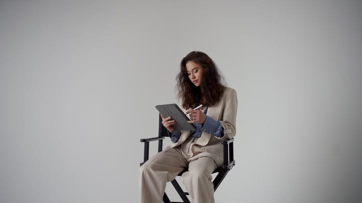 Fashionable Professional Woman Engages With Digital Tablet