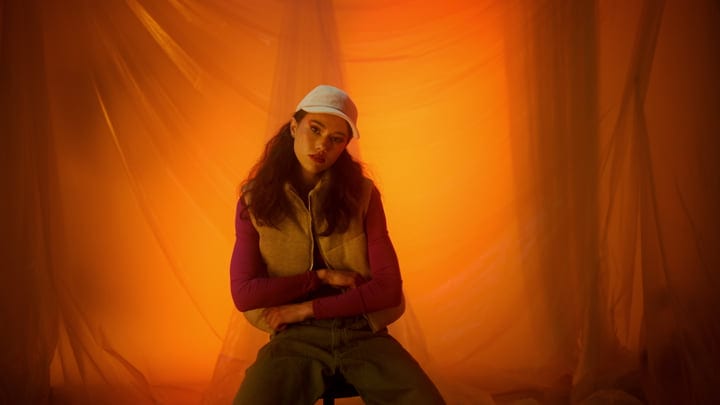 Embrace Seasonal Fashion Against a Warm Backdrop