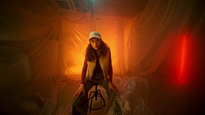 A Fashionable Moment Captured Amidst Warm Studio Lights