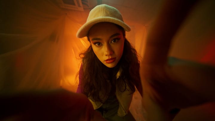 Youthful Gaze Captured In Warm Studio Glow
