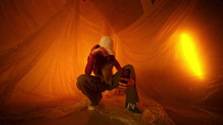 Bold Fashion Choices Amidst a Warm Amber Glow