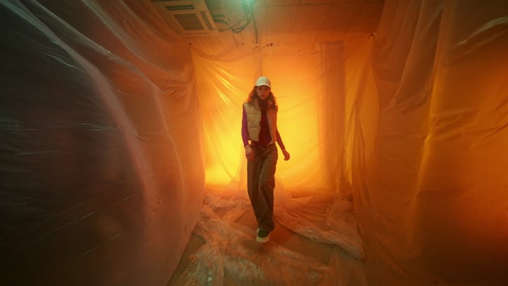 Striding Through The Glow Of A Neon Studio