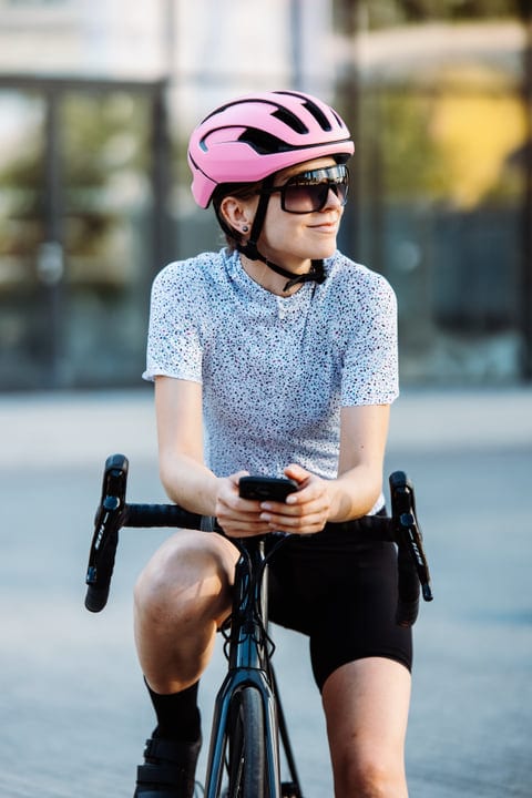 City Cyclist Pauses to Enjoy the Urban Morning Light
