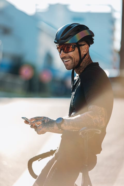 Urban Cyclist Pauses for a Moment in the Sun