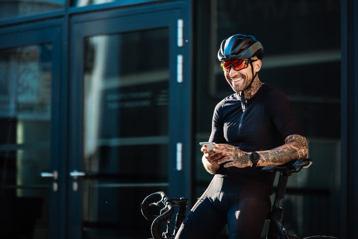 Urban Cyclist Takes a Break With a Smile