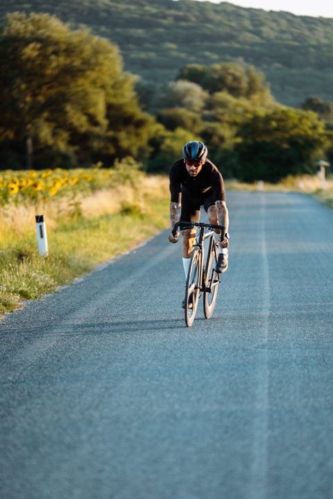 A Cyclist's Journey Through Sunlit Country Roads