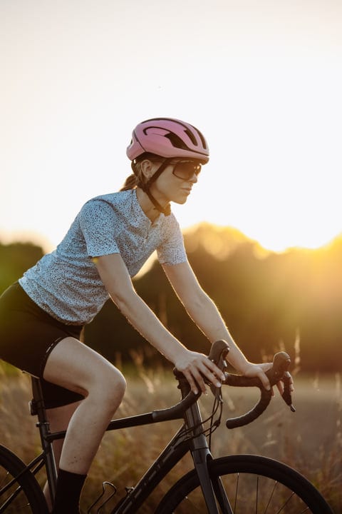 Cyclist Embraces The Sunset On A City Ride
