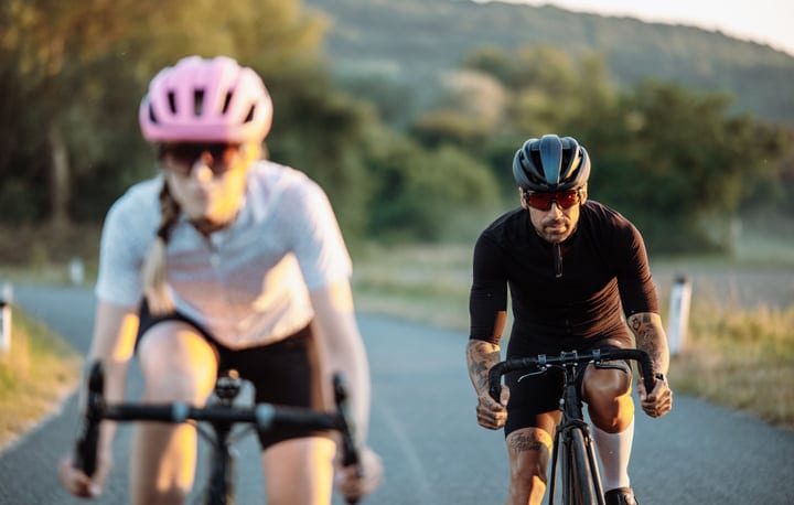 Morning Light Guides Cyclists Through Urban Serenity