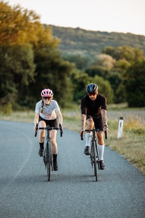 Two Cyclists Embrace the Open Road in Evening Glow