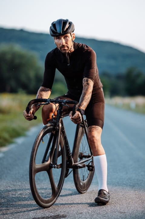 Tattooed Cyclist Conquers Urban Trails With Determination