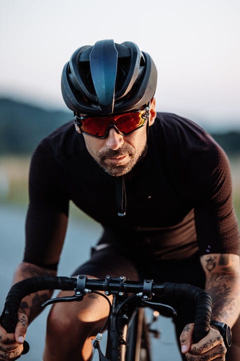 Focused Cyclist Navigates Urban Streets With Determination