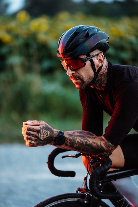 Tattooed Cyclist Embraces the Golden Hour Ride