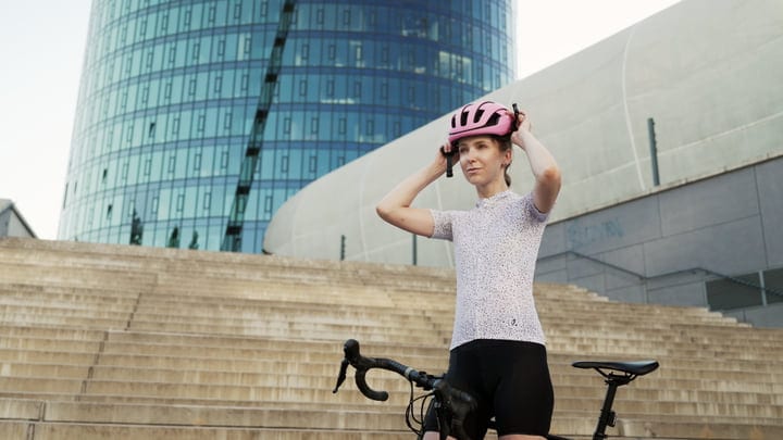 A Cyclist Prepares For City Adventure On Urban Steps