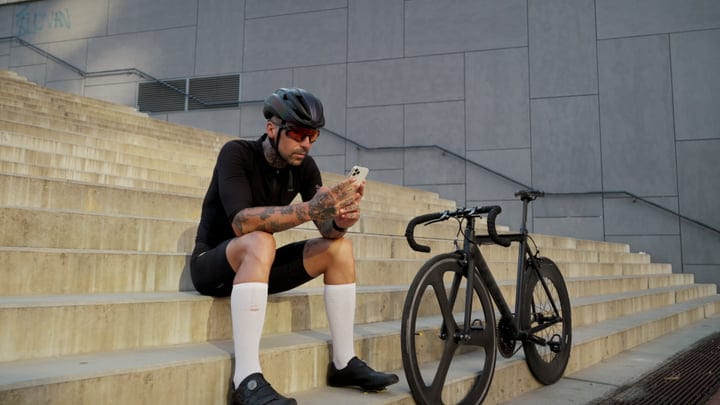 Urban Cyclist Takes a Break on City Steps