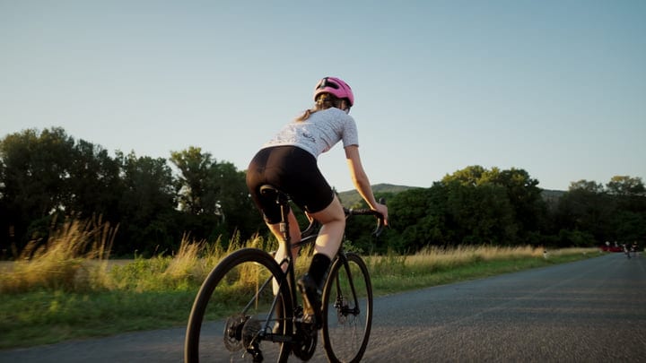 Cyclist Embraces Freedom On A Serene City Ride