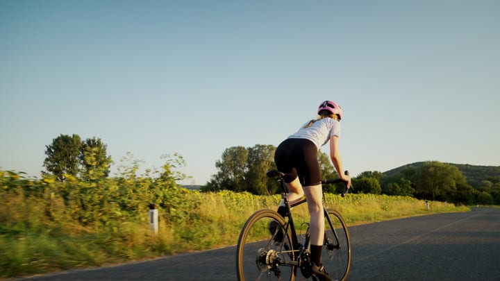 Cyclist Enjoys an Early Morning Ride in Nature