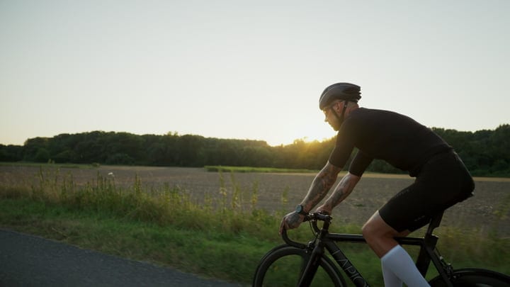 Cyclist Enjoys a Serene Ride At Sunset