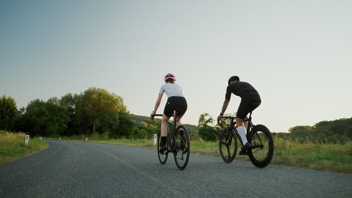 Cyclists Embrace Freedom On A Serene Country Road