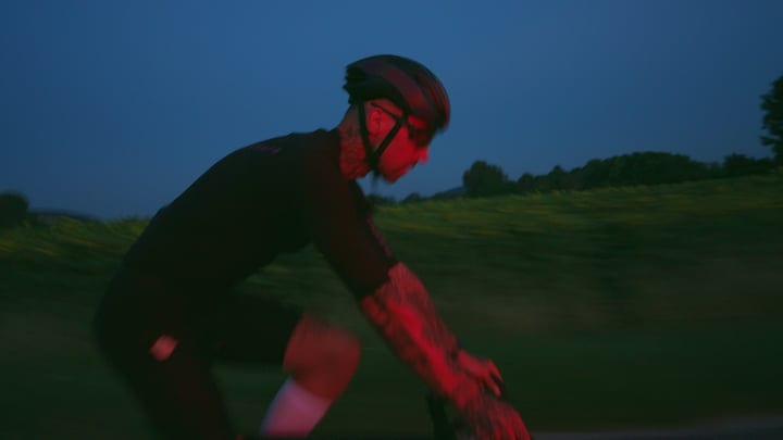 Cyclist Embraces the Evening Ride Through Urban Streets