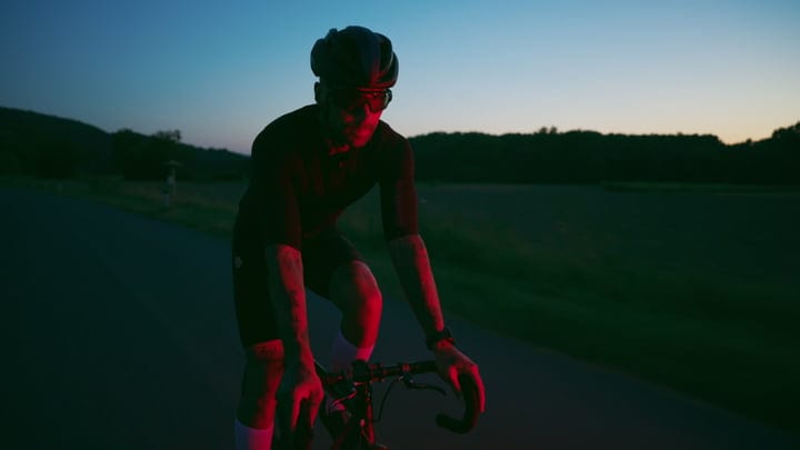 Cyclist Embraces Twilight Journey Through City Streets