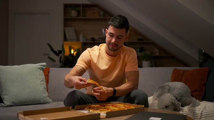 Man Balances Remote Work With Relaxing Pizza Night