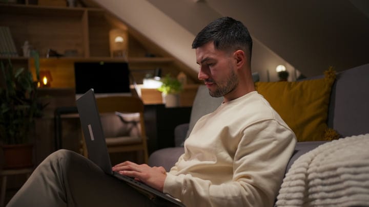 Evening Focus: Man Engaged In Home Office Routine
