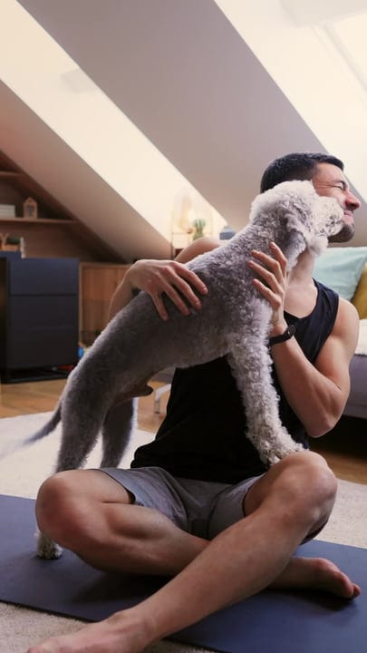 A Man Finds Joy In His Canine Companion's Cuddle