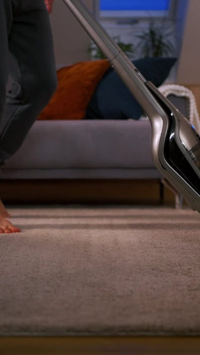 A Man Finds Productivity While Vacuuming His Home Office