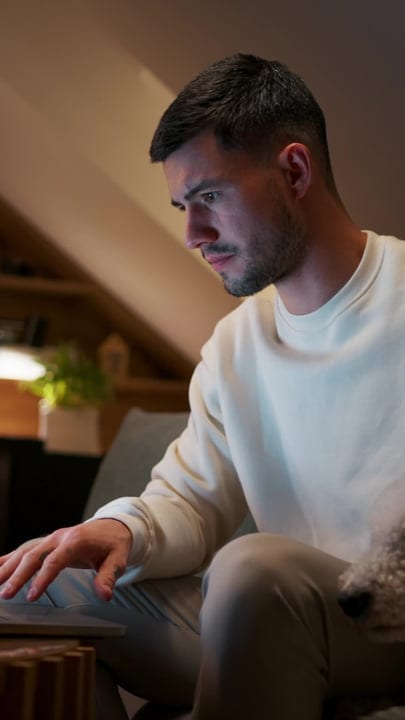 Focused Man Engages With Work In Cozy Home Office