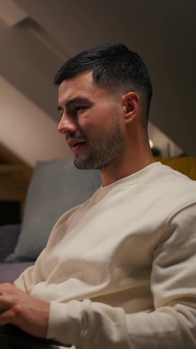 Focused Man Engages With Laptop In Cozy Home Setting