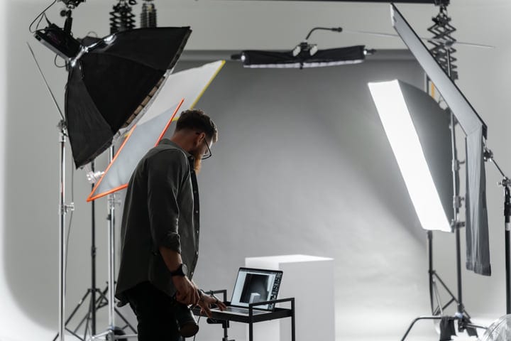 Photographer Engages in Creative Process Within Studio Setup