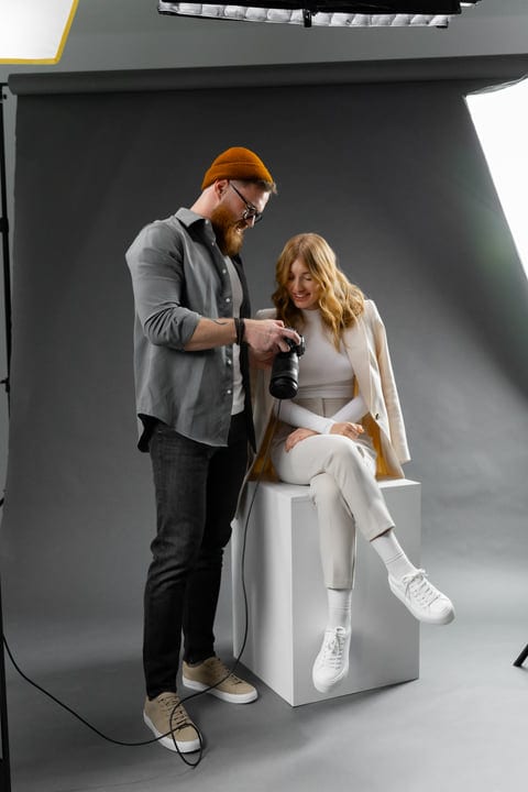 Collaborative Magic: Photographer and Model Review Shots Together